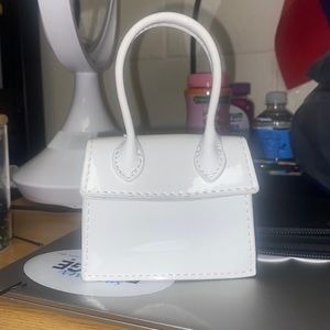 Tiny white purse